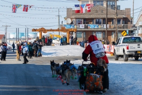 Ryan Redington runs down Front Street toward the finish line in Nome during the 2017 Iditarod on Wednesday March 15, 2017.Photo by Jeff Schultz/SchultzPhoto.com  (C) 2017  ALL RIGHTS RESERVED