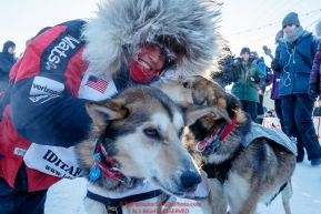 Shorlty after finishing in 8th place, Aliy Zirkle hugs her lead dogs Dutch and Sparky in the finish chute in Nome during the 2017 Iditarod on Wednesday March 15, 2017.Photo by Jeff Schultz/SchultzPhoto.com  (C) 2017  ALL RIGHTS RESERVED