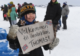 Aliana Towarak welcomes Iditarod musher Thomas Waerner at the Unalakleet, AK Iditarod checkpoint after the musher arrived in first place on Sunday, March 15, 2020. Towarakâs motherâs family is from Norway. (Photo by Bob Hallinen)