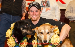 Dallas Seavey and his lead dogs Beatle and Reef pose for photos at the musher 's finishers banquet in Nome on Sunday March 16 after the 2014 Iditarod Sled Dog Race.PHOTO (c) BY JEFF SCHULTZ/IditarodPhotos.com -- REPRODUCTION PROHIBITED WITHOUT PERMISSION