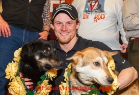 Dallas Seavey and his lead dogs Beatle and Reef pose for photos at the musher 's finishers banquet in Nome on Sunday March 16 after the 2014 Iditarod Sled Dog Race.PHOTO (c) BY JEFF SCHULTZ/IditarodPhotos.com -- REPRODUCTION PROHIBITED WITHOUT PERMISSION