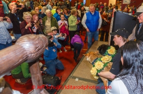 A crowd of race fans take photos of Dallas Seavey and his lead dogs Beatle and Reef as they pose at the musher 's finishers banquet in Nome on Sunday March 16 after the 2014 Iditarod Sled Dog Race.PHOTO (c) BY JEFF SCHULTZ/IditarodPhotos.com -- REPRODUCTION PROHIBITED WITHOUT PERMISSION