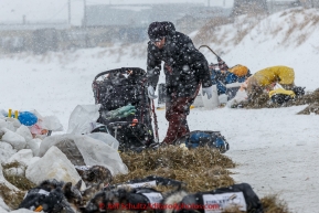 Richie Diehl unpacks after his arrival at the Unalakleet checkpoint on Monday March 16, 2015 during Iditarod 2015.  (C) Jeff Schultz/SchultzPhoto.com - ALL RIGHTS RESERVED DUPLICATION  PROHIBITED  WITHOUT  PERMISSION