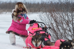 DeeDee Jonrow manuevers her sled up a side hill on the trail in the evening a few miles before the Unalakleet checkpoint on Monday March 16, 2015 during Iditarod 2015.  (C) Jeff Schultz/SchultzPhoto.com - ALL RIGHTS RESERVED DUPLICATION  PROHIBITED  WITHOUT  PERMISSION