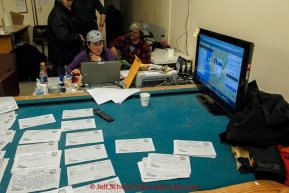 Nancy Yoshida works the comms table at the Unalakleet checkpoint on Monday March 16, 2015 during Iditarod 2015.  (C) Jeff Schultz/SchultzPhoto.com - ALL RIGHTS RESERVED DUPLICATION  PROHIBITED  WITHOUT  PERMISSION