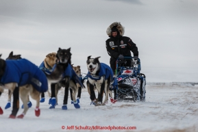 Rookie Jason Campeau runs on the slough leaving the Unalakleet checkpoint in 35 mph winds in the morning on Monday March 16, 2015 during Iditarod 2015.  (C) Jeff Schultz/SchultzPhoto.com - ALL RIGHTS RESERVED DUPLICATION  PROHIBITED  WITHOUT  PERMISSION