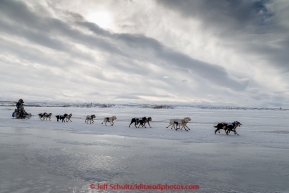 Ray Redington Jr. on the trail in 30 mph wind several miles before arriving at the Unalakleet checkpoint on Monday March 16, 2015 during Iditarod 2015.  (C) Jeff Schultz/SchultzPhoto.com - ALL RIGHTS RESERVED DUPLICATION  PROHIBITED  WITHOUT  PERMISSION