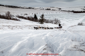 Christian Turner runs up the trail in 30 mph wind several miles before the Unalakleet checkpoint on Monday March 16, 2015 during Iditarod 2015.  (C) Jeff Schultz/SchultzPhoto.com - ALL RIGHTS RESERVED DUPLICATION  PROHIBITED  WITHOUT  PERMISSION