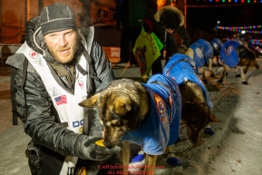 Noah Burmeister poses with his lead dogs at the finish line in Nome shortly after finishing in 29th place during the 2017 Iditarod on Thursday March 16, 2017.Photo by Jeff Schultz/SchultzPhoto.com  (C) 2017  ALL RIGHTS RESERVED