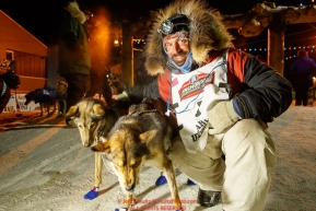 Cody Strathe poses with his lead dogs after he arrived at the finish line in Nome in 30th place during the 2017 Iditarod on Thursday March 16, 2017.Photo by Jeff Schultz/SchultzPhoto.com  (C) 2017  ALL RIGHTS RESERVED
