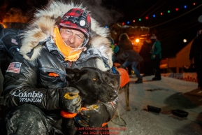 Martin Buser poses with his lead dog at the finish line in Nome during the 2017 Iditarod on Thursday March 16, 2017.Photo by Jeff Schultz/SchultzPhoto.com  (C) 2017  ALL RIGHTS RESERVED