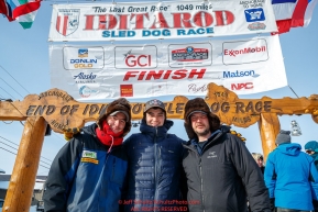 The three Redington Brothers, Ryan, Robert and Ray Jr. , pose at the finish line in Nome after they finished the 2017 Iditarod on Thursday March 16, 2017.Photo by Jeff Schultz/SchultzPhoto.com  (C) 2017  ALL RIGHTS RESERVED