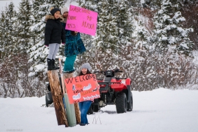 Kids from the Koyuk checkpoing created signs to great mushers along the Iditarod trail on March 16, 2020.