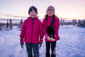 Local kids from Koyuk came out to see the sled dogs and showed off their new puppy on March 16, 2020.