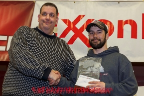 Kenny Gill presents the Horizon Lines Most Improved Musher Award to Richie Diehl at the musher 's finishers banquet in Nome on Sunday March 16 after the 2014 Iditarod Sled Dog Race.PHOTO (c) BY JEFF SCHULTZ/IditarodPhotos.com -- REPRODUCTION PROHIBITED WITHOUT PERMISSION