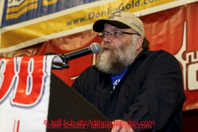 Race Marshal Mark Nordman announces the checkpoint of Galena as the Golden Clipboard award winner for the best checkpoint at the musher 's finishers banquet in Nome on Sunday March 16 after the 2014 Iditarod Sled Dog Race.PHOTO (c) BY JEFF SCHULTZ/IditarodPhotos.com -- REPRODUCTION PROHIBITED WITHOUT PERMISSION