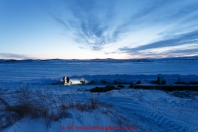 Volunteers work early in the morning at the Unalakleet checkpoint on Tuesday March 16, 2015 during Iditarod 2015.  (C) Jeff Schultz/SchultzPhoto.com - ALL RIGHTS RESERVED DUPLICATION  PROHIBITED  WITHOUT  PERMISSION