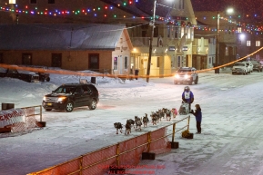 Geir Idar Hjelvik runs down Front Street in Nome on his way to 45th place and the finish line in Nome during the 2017 Iditarod on Friday March 17, 2017.Photo by Jeff Schultz/SchultzPhoto.com  (C) 2017  ALL RIGHTS RESERVED
