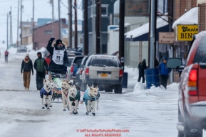 Gunnar Johnson runs down Front Street on the way to the finish line in Nome  during the 2017 Iditarod on Friday March 17, 2017.Photo by Jeff Schultz/SchultzPhoto.com  (C) 2017  ALL RIGHTS RESERVED