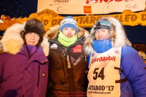 Three Norwegian mushers Ketil Reitan, Joar Leifseth Ulsom and Geir Idar Hjelvik at the finish line in Nome after Geir arrived in 45th place during the 2017 Iditarod on Friday March 17, 2017.Photo by Jeff Schultz/SchultzPhoto.com  (C) 2017  ALL RIGHTS RESERVED