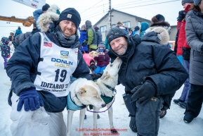 Gunnar Johnson poses at the finish line with his lead dogs Delta and Queen along with the dog's owner, Iditarod musher Jim Lanier in Nome  during the 2017 Iditarod on Friday March 17, 2017.Photo by Jeff Schultz/SchultzPhoto.com  (C) 2017  ALL RIGHTS RESERVED