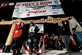 Dallas Seavey talks with Leo Rassumuson after winning his 3rd Iditarod in 8 days 18 hours 13 minutes 6 seconds with lead dogs Reef and Hero on Wednesday March 18, 2015 during Iditarod 2015.  (C) Jeff Schultz/SchultzPhoto.com - ALL RIGHTS RESERVED DUPLICATION  PROHIBITED  WITHOUT  PERMISSION