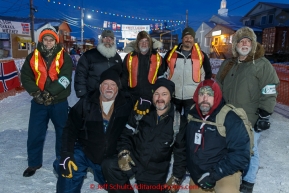 Volunteer Security guards pose for a photo at the Nome finish line on Wednesday March 18, 2015 during Iditarod 2015.  (C) Jeff Schultz/SchultzPhoto.com - ALL RIGHTS RESERVED DUPLICATION  PROHIBITED  WITHOUT  PERMISSION