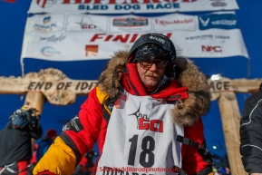 Mitch Seavey poses for a photo at the Nome finish line after finishing in second place on Wednesday March 18, 2015 during Iditarod 2015.  (C) Jeff Schultz/SchultzPhoto.com - ALL RIGHTS RESERVED DUPLICATION  PROHIBITED  WITHOUT  PERMISSIO8