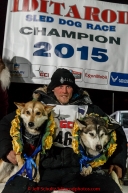 Dallas Seavey's dogs Reef and Hero recieve the garland of roses on the winner stand after Dallas won his 3rd Iditarod in 8 days 18 hours 13 minutes 6 seconds on Wednesday March 18, 2015 during Iditarod 2015.  (C) Jeff Schultz/SchultzPhoto.com - ALL RIGHTS RESERVED DUPLICATION  PROHIBITED  WITHOUT  PERMISSION
