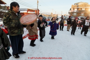 The Nome St. Lawrence Island Dancers play and dance at the Nome finish line on Wednesday March 18, 2015 as Aaron Burmeister crossed the finish line during Iditarod 2015.  (C) Jeff Schultz/SchultzPhoto.com - ALL RIGHTS RESERVED DUPLICATION  PROHIBITED  WITHOUT  PERMISSION