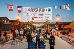 Matthew Failor and Michael Baker in the finish chute in Nome during the 2017 Iditarod on Saturday March 18, 2017.Photo by Jeff Schultz/SchultzPhoto.com  (C) 2017  ALL RIGHTS RESERVED