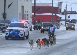 Joar Leifseth Ulsom drives his team down Front Street in Nome, AK to finish the 2020 Iditarod Trail Sled Dog Race in 6th place on Front Street on Wednesday, March 18, 2020. (Photo by Bob Hallinen)