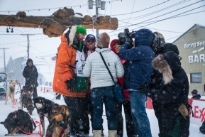 Kelly Maixner is surrounded by media after completing the Iditarod in Nome, AK on March 18, 2020.