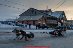 Richie Diehl runs down Front Street toward the finish line in Nome on Thursday March 19, 2015 during Iditarod 2015.  (C) Jeff Schultz/SchultzPhoto.com - ALL RIGHTS RESERVED DUPLICATION  PROHIBITED  WITHOUT  PERMISSION