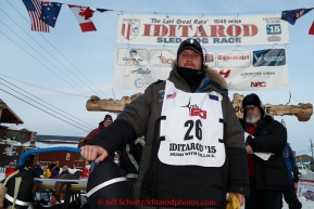 Nathan Schroeder poses for a photo at the finish line in Nome after completing his race on Thursday March 19, 2015 during Iditarod 2015.  (C) Jeff Schultz/SchultzPhoto.com - ALL RIGHTS RESERVED DUPLICATION  PROHIBITED  WITHOUT  PERMISSION