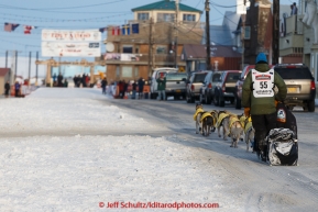 Matts Pettersson runs down Front Street on his way toward the finish line in Nome on Thursday March 19, 2015 during Iditarod 2015.  (C) Jeff Schultz/SchultzPhoto.com - ALL RIGHTS RESERVED DUPLICATION  PROHIBITED  WITHOUT  PERMISSION