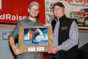 The PenAir Spirit of Alaska Award is Presented by Dave Hall,Â chief operating officer of PenAir to Wade Marrs at the Nome Musher's Award Banquet during the 2017 Iditarod on Sunday March 19, 2017.Photo by Jeff Schultz/SchultzPhoto.com  (C) 2017  ALL RIGHTS RESERVED