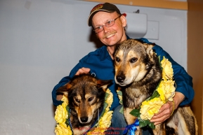 First place winner Mitch Seavey poses with his lead dogs Crisp and Pilot at the musher awards ceremony  in Nome during the 2017 Iditarod on Sunday March 19, 2017.Photo by Jeff Schultz/SchultzPhoto.com  (C) 2017  ALL RIGHTS RESERVED