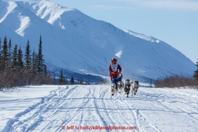 Joan Klejka and team run down the trail on the Denali Highway with the Alaska Range in the background during the start day of the 2015 Junior Iditarod on Sunday March 1, 2015(C) Jeff Schultz/SchultzPhoto.com - ALL RIGHTS RESERVED DUPLICATION  PROHIBITED  WITHOUT  PERMISSION
