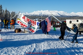 Volunteers erect the start and finish banner for the 2015 Junior Iditarod start along the Denali Highway on Sunday March 1, 2015.(C) Jeff Schultz/SchultzPhoto.com - ALL RIGHTS RESERVED DUPLICATION  PROHIBITED  WITHOUT  PERMISSION