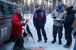 Part of the volunteer veterinarian team talks with musher Kristin Bacon at the pre-race vet-check for dogs running this year's 2017 Iditarod at Iditarod Headquarters in Wasilla, Alaska.  Wednesday March 1, 2017Photo by Jeff Schultz/SchultzPhoto.com  (C) 2017  ALL RIGHTS RESVERVED