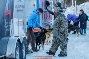 Spectators brave the 30mph wind to view the dogs and see the mushers at the pre-race vet-check for dogs running this year's 2017 Iditarod at Iditarod Headquarters in Wasilla, Alaska.  Wednesday March 1, 2017Photo by Jeff Schultz/SchultzPhoto.com  (C) 2017  ALL RIGHTS RESVERVED