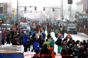 4th Avenue is jammed with people and dog trucks prior to the ceremonial start of the Iditarod sled dog race in downtown Anchorage Saturday, March 2, 2013. Photo (C) Jeff Schultz/IditarodPhotos.com  Do not reproduce without permission