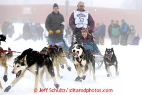 Bob Bundtzen team rounds the Cordova Street turn during the ceremonial start of the Iditarod sled dog race Anchorage Saturday, March 2, 2013. Photo (C) Jeff Schultz/IditarodPhotos.com  Do not reproduce without permission