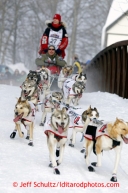 Aliyn Zirkle runs over the bridge at Chester Creek during the ceremonial start of the Iditarod sled dog race Anchorage Saturday, March 2, 2013. Photo (C) Jeff Schultz/IditarodPhotos.com  Do not reproduce without permission