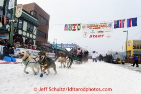 Jason Mackey runs down the chute on 4th avenue during ceremonial start of the Iditarod sled dog race Anchorage Saturday, March 2, 2013. Photo (C) Jeff Schultz/IditarodPhotos.com  Do not reproduce without permission