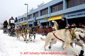 Paige Drobny leaves the Anchorage ceremonial start of the Iditarod sled dog race Anchorage Saturday, March 2, 2013. Photo (C) Jeff Schultz/IditarodPhotos.com  Do not reproduce without permission