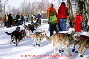 Rudy Demoski Sr. rounds the bend at the Goose Lake turn during the ceremonial start of the Iditarod sled dog race Anchorage Saturday, March 2, 2013. Photo (C) Jeff Schultz/IditarodPhotos.com  Do not reproduce without permission