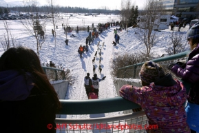 Spectators watch Wade Marrs along the bike/ski trail during the ceremonial start of the Iditarod sled dog race Anchorage Saturday, March 2, 2013. Photo (C) Jeff Schultz/IditarodPhotos.com  Do not reproduce without permission