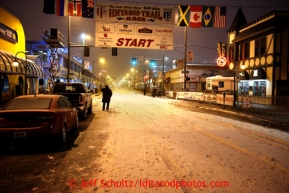 Iditarod Executive Director Stan Hooley surveys the start line in the early hours prior to the ceremonial start of the Iditarod sled dog race in downtown Anchorage Saturday, March 2, 2013. Photo (C) Jeff Schultz/IditarodPhotos.com  Do not reproduce without permission